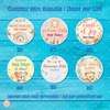 Set of personalized gift baby labels with various designs on a blue wooden background